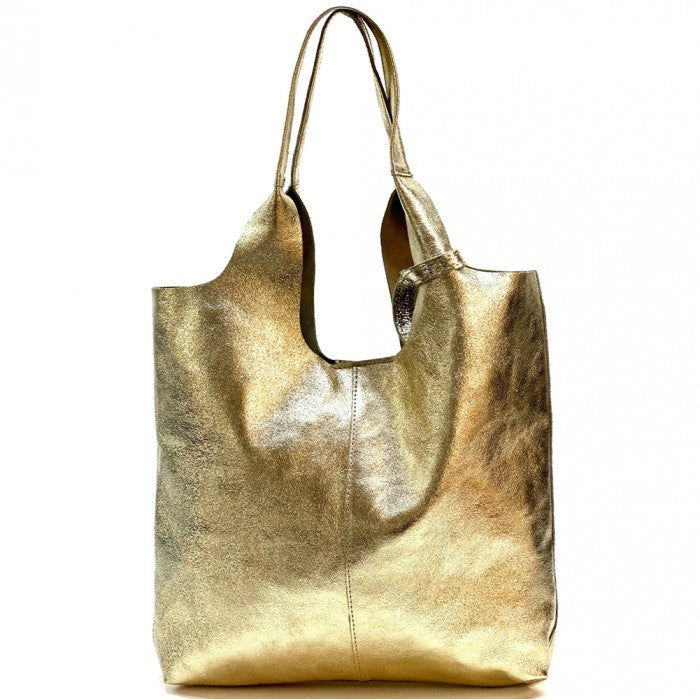 Bolso tote shopper de cuero dorado metalizado textura brillante fondo blanco